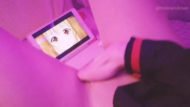Young girl watches anime porn and fingers her wet pussy